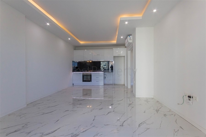 Большая квартира 1+1 в районе Махмутлар 