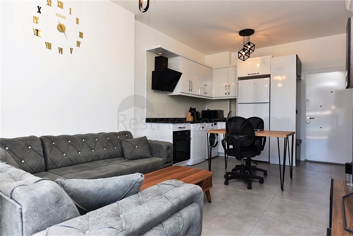 Меблированная двухкомнатная квартира в районе Махмутлар