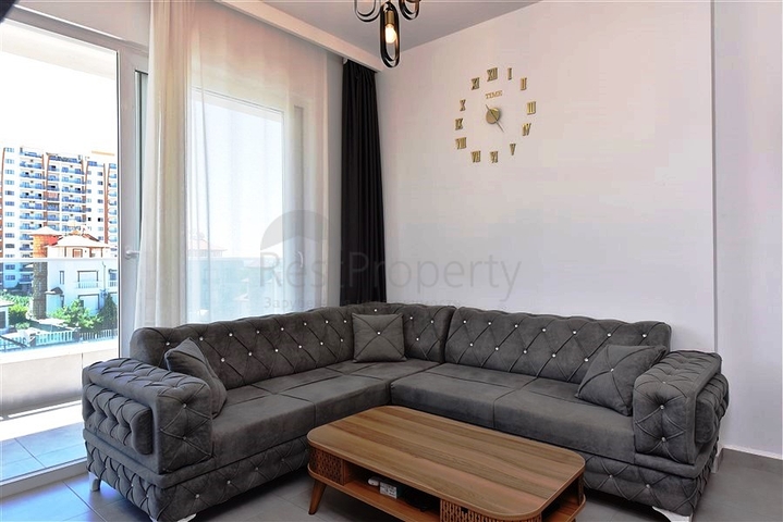 Меблированная двухкомнатная квартира в районе Махмутлар