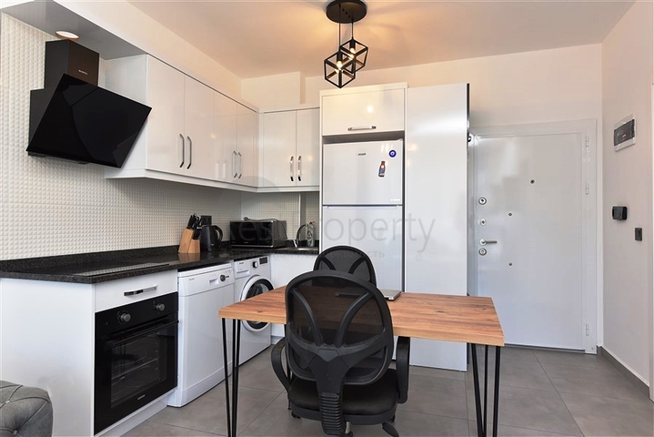 Меблированная двухкомнатная квартира в районе Махмутлар