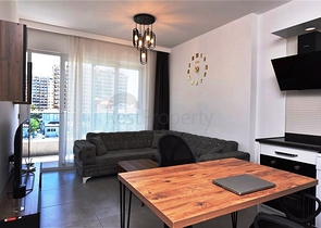 Меблированная двухкомнатная квартира в районе Махмутлар