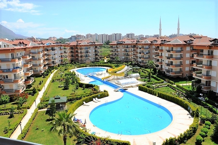 Квартира 2+1 с дизайнерским ремонтом в одном из самых зеленых комплексов Алании