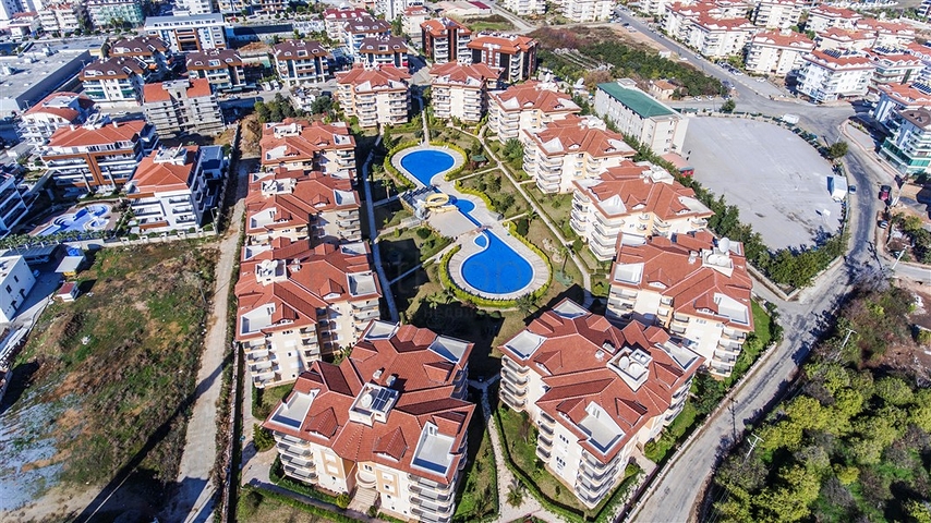 Квартира 2+1 с дизайнерским ремонтом в одном из самых зеленых комплексов Алании