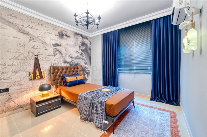 Квартира 2+1 с дизайнерским ремонтом в одном из самых зеленых комплексов Алании