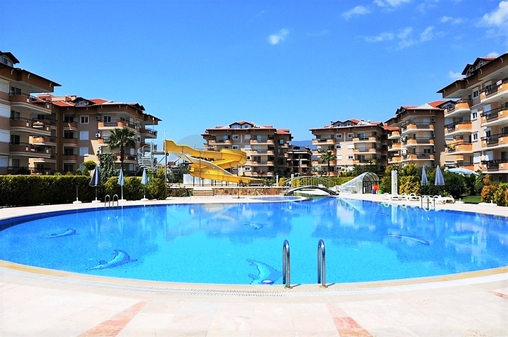 Квартира 2+1 с дизайнерским ремонтом в одном из самых зеленых комплексов Алании