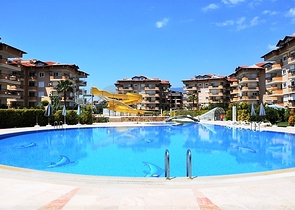 Квартира 2+1 с дизайнерским ремонтом в одном из самых зеленых комплексов Алании