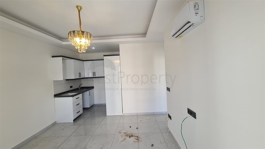 Новая двухкомнатная квартира в Махмутларе