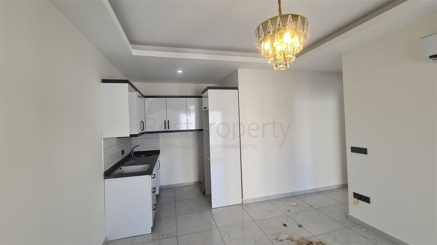 Новая двухкомнатная квартира в Махмутларе