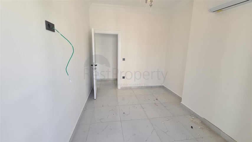 Новая двухкомнатная квартира в Махмутларе