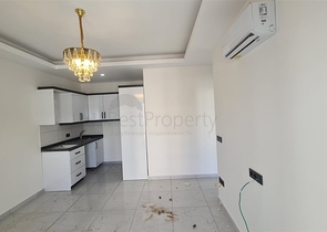 Новая двухкомнатная квартира в Махмутларе