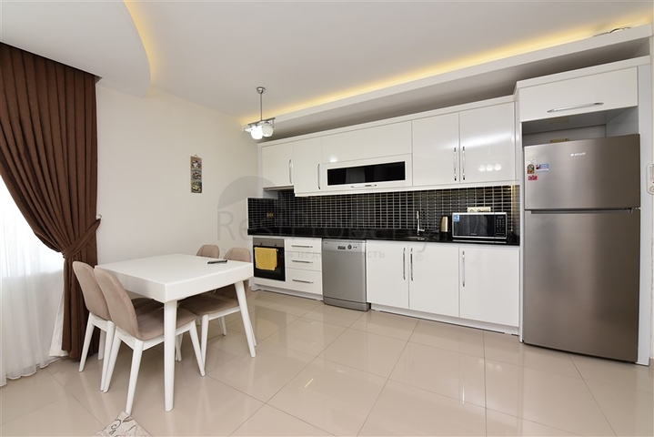 Двухкомнатная квартира в Махмутларе 