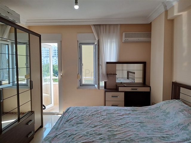 Квартира 2+1 на первой береговой линии в Махмутларе 