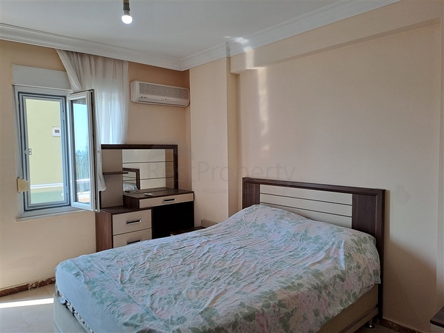 Квартира 2+1 на первой береговой линии в Махмутларе 