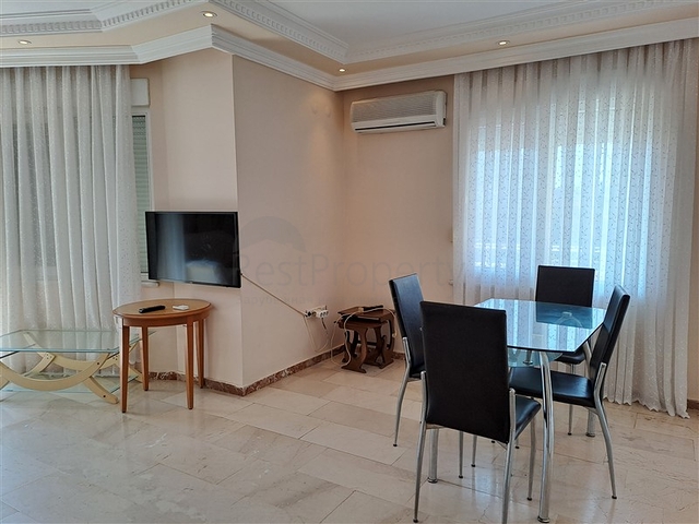 Квартира 2+1 на первой береговой линии в Махмутларе 