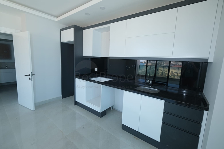 Квартира 1+1 на берегу моря в Махмутларе