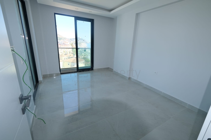 Квартира 1+1 на берегу моря в Махмутларе