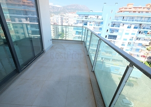 Квартира 1+1 на берегу моря в Махмутларе