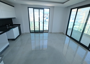 Квартира 1+1 на берегу моря в Махмутларе