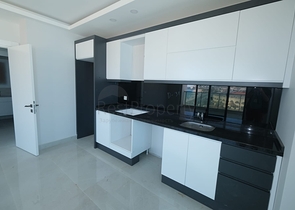 Квартира 1+1 на берегу моря в Махмутларе