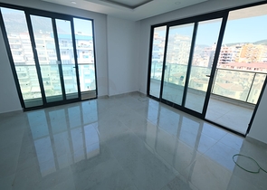 Квартира 1+1 на берегу моря в Махмутларе