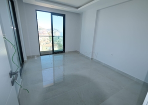 Квартира 1+1 на берегу моря в Махмутларе