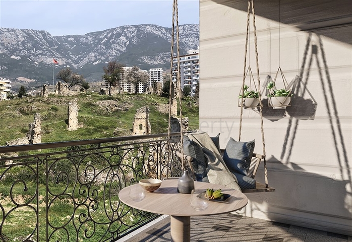 Квартира планировкой 1+1 в современном доме в районе Махмутлар