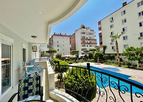 Трехкомнатная квартира в районе Махмутлар