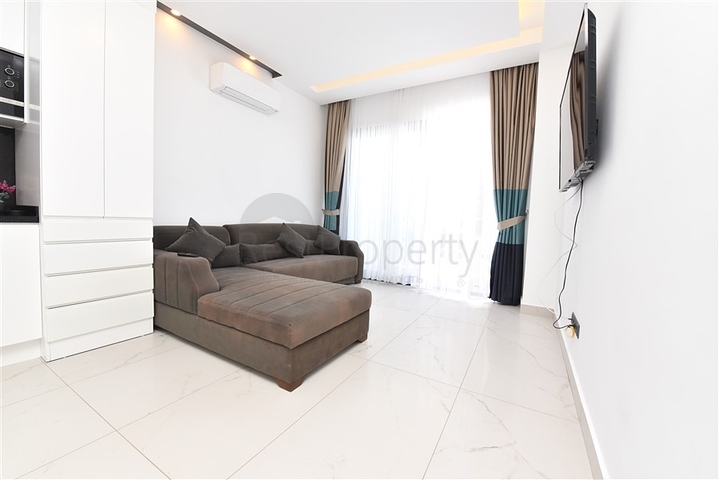 Трехкомнатную меблированную квартиру в районе Каргыджак