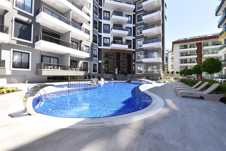 Трехкомнатную меблированную квартиру в районе Каргыджак