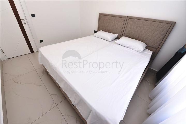 Трехкомнатную меблированную квартиру в районе Каргыджак