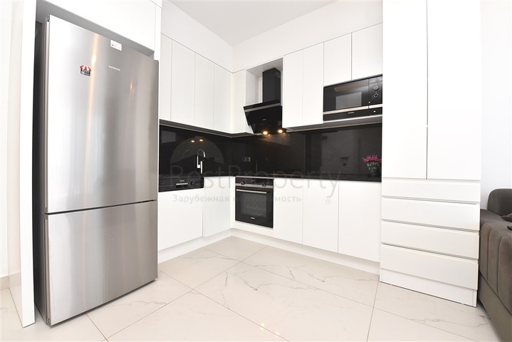 Трехкомнатную меблированную квартиру в районе Каргыджак