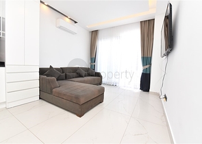 Трехкомнатную меблированную квартиру в районе Каргыджак