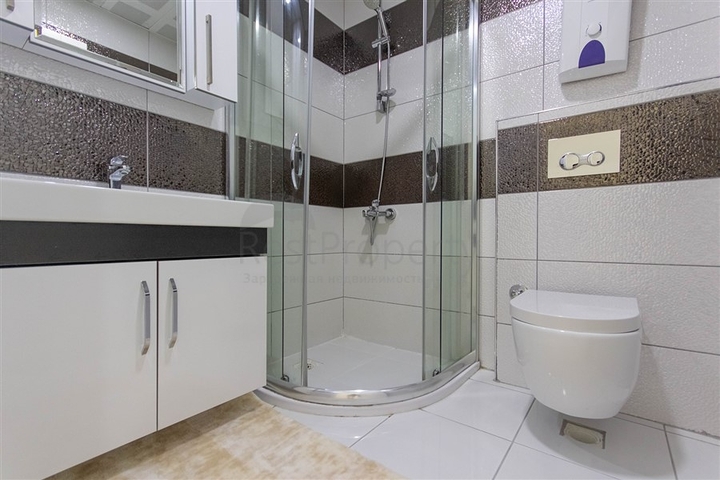 Трехкомнатная квартира в Махмутларе 