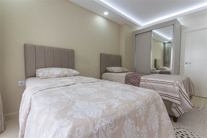 Трехкомнатная квартира в Махмутларе 