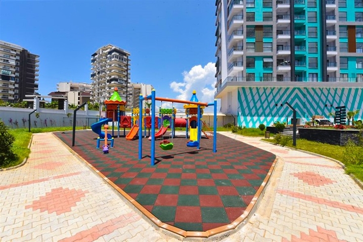 Квартира планировки 1+1 в новом комплексе в районе Махмутлар