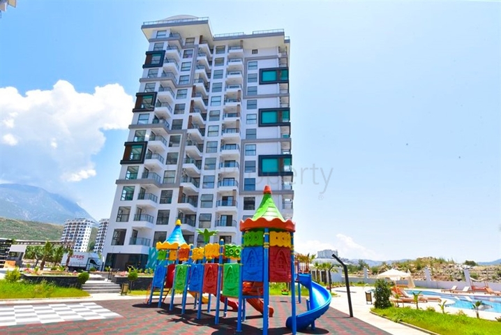 Квартира планировки 1+1 в новом комплексе в районе Махмутлар