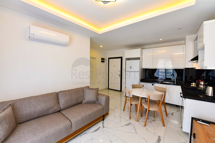 Квартира планировки 1+1 в новом комплексе в районе Махмутлар