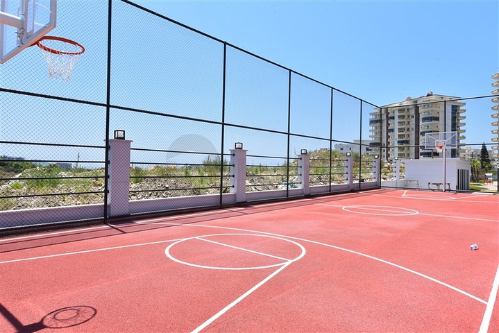 Квартира планировки 1+1 в новом комплексе в районе Махмутлар