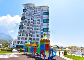 Квартира планировки 1+1 в новом комплексе в районе Махмутлар