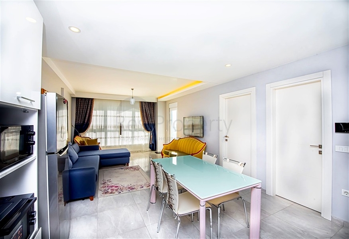 Просторная двухкомнатная квартира в Махмутларе