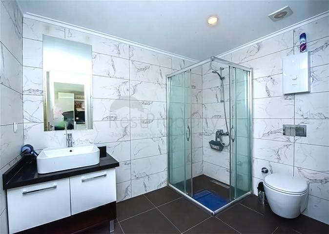 Просторная двухкомнатная квартира в Махмутларе