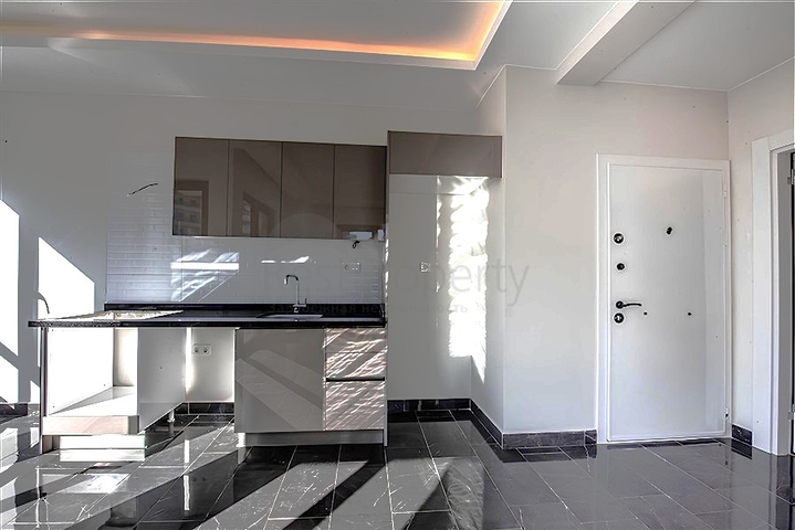 Квартира 1+1 в новом жилом комплексе района Махмутлар по выгодной цене 