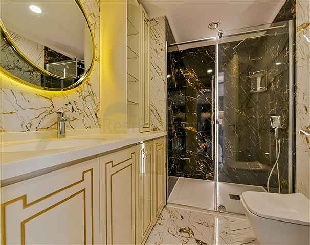 Квартира 1+1 на первой береговой линии в Махмутларе