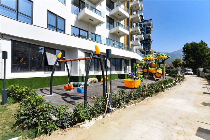 Квартира 1+1 на первой береговой линии в Махмутларе