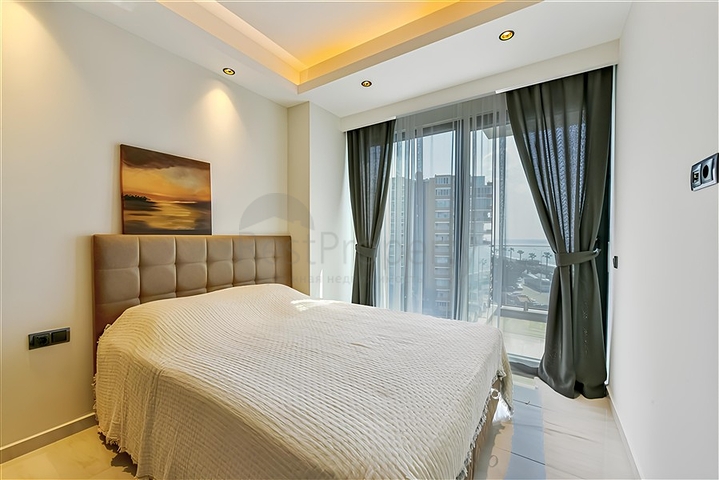 Квартира 1+1 на первой береговой линии в Махмутларе