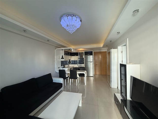 Двухкомнатная квартира в шикарном комплексе района Махмутлар