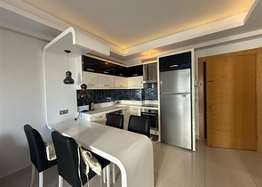 Двухкомнатная квартира в шикарном комплексе района Махмутлар