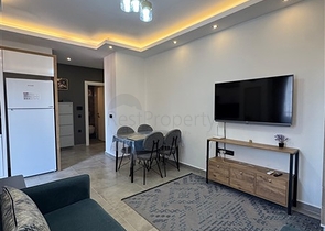 Современная квартира 1+1 в новом комплексе в Махмутларе всего 350 м от моря