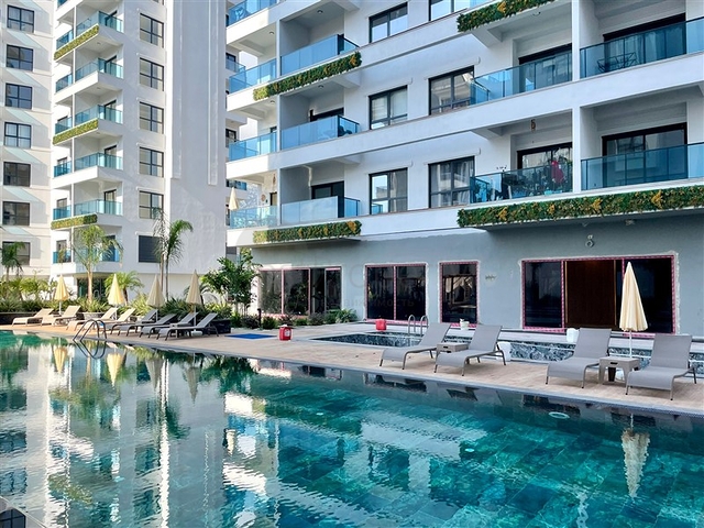 Современная квартира 1+1 в новом комплексе с бассейном и спа-зоной в Махмутларе