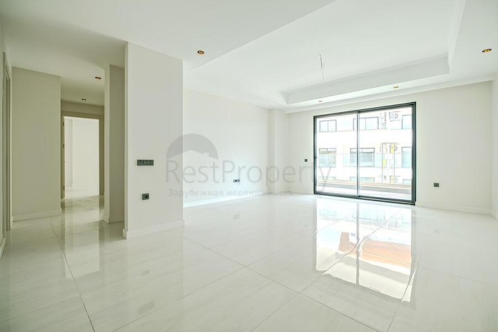 Современная квартира 2+1 в новом жилом комплексе у моря в районе Тюрклер